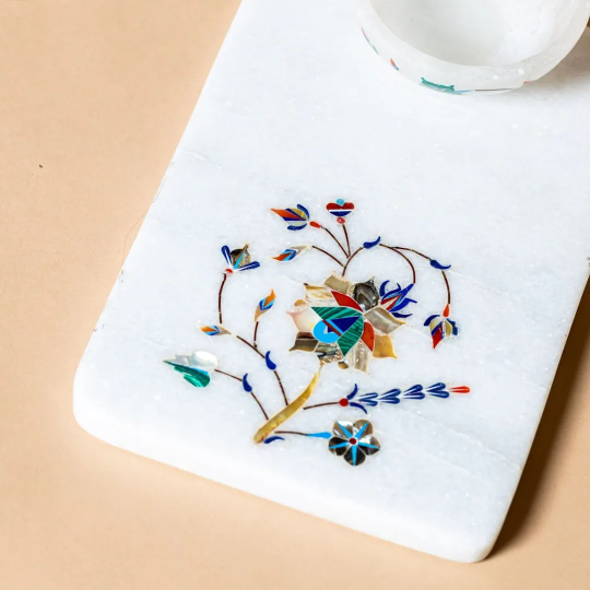 Artisanal marble cheese board with a dip bowl